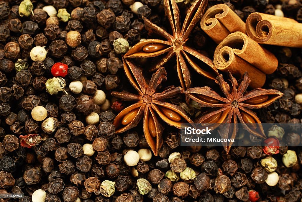 Spices Color pepper with cinnamon sticks and anise stars. Anise Stock Photo