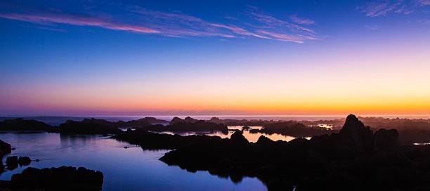 Sunset and Rocks at the Coast stock photo