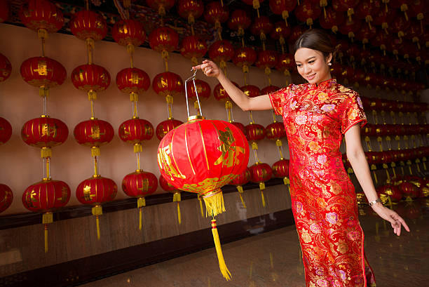 istock girl in qipao holding lantern 471304972
