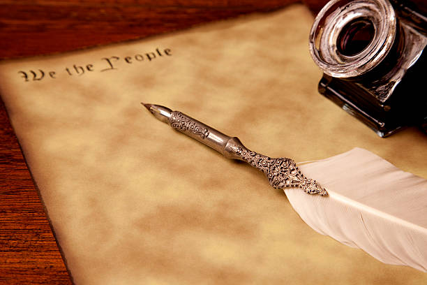 istock We the People, US Constitution metaphor, pen and ink 471305035