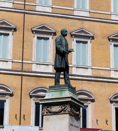 Rome, Italy - March 12, 2015: A statue for Marco Minghetti in Rome. Buildings can be seen in the background.
