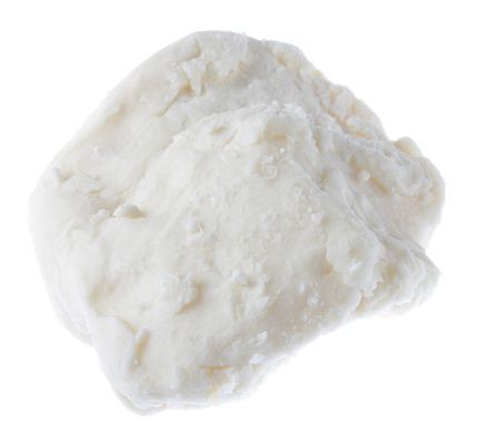 raw organic ghanaian shea butter isolated on white