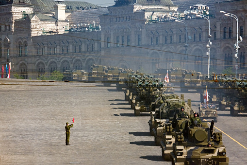 Moscow, Russia - May 5, 2008: Russian soldier stands near the convoy of rocket launchers in military parade rehearsal on Red Square, Moscow