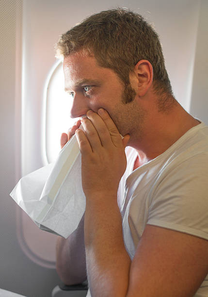 istock Airsickness. Man feels very bad on the plane. 471307988