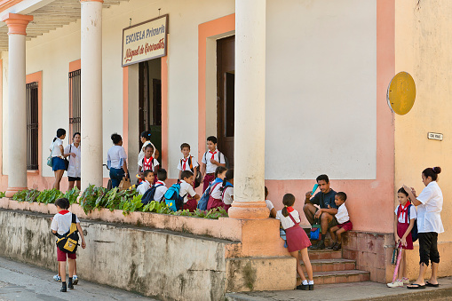 Baracoa, Cuba - January 11, 2007: Cuban children in school uniform in front of the Escuela Primaria, Elementary School.