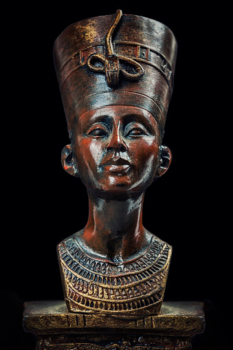 Famous Statuette Bust of Queen Nefertiti Isolated on Black Background