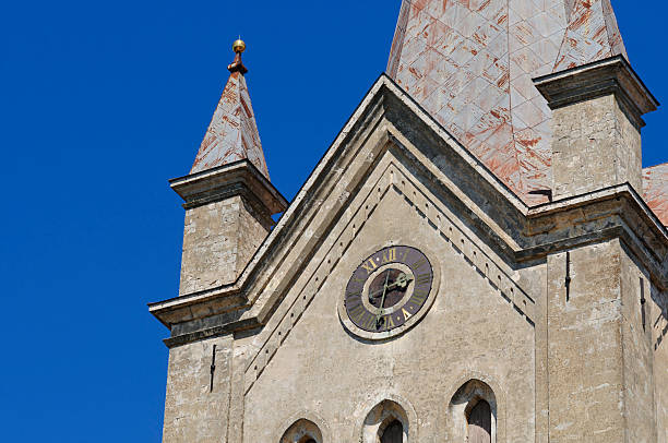 Clock tower Old clock on church tower in Cesis, Latvia. Converted from Nikon RAW. color image roman numeral rusty time stock pictures, royalty-free photos & images