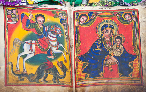 Ancient book in an Orthodox Church, Axum, Ethiopia An  old, handwritten and handpainted book (approx. 13th - 14th century). The book is written in the ancient language Geez, which is not used anymore except as liturgical language of the Ethiopian Orthodox Tewahedo Church, ethiopian orthodox church stock pictures, royalty-free photos & images