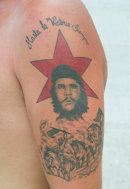Havana, Cuba - September 4, 2005: Tattoo of Che Guevara with red star features his famous slogan, Hasta la Victoria Siempre. The Che portrait is seen on pins, t-shirts, billboards, and tattoos all over Cuba.