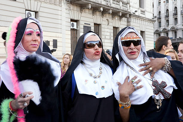 Buenos Aires, Argentina. November 7, 2009: Three men in the gay community, marching with dresses of exotic nun. Context: annual Gay Pride march in Buenos Aires by the motto Liberty and Equal Rights. The photo shows the sophistication and creativity of the costumes on this celebration. 