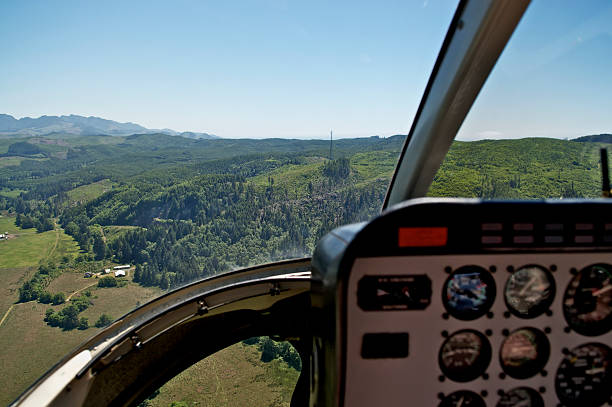 istock Aerial View from Helicopter Cockpit with Forested Hill 471315533