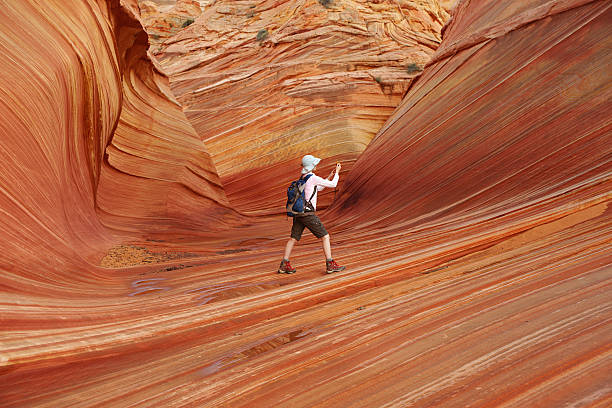 istock The Wave at North Coyote Buttes with Hiker 471315621