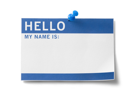 Blue name badge with the words, \