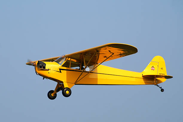 Blakesburg, Iowa, USA - September 1, 2008: Piper Cub airplane in typical bright yellow factory paint. Built in 1946.