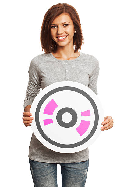 istock Smiling young woman holding CD sign isolated on white background. 471317837