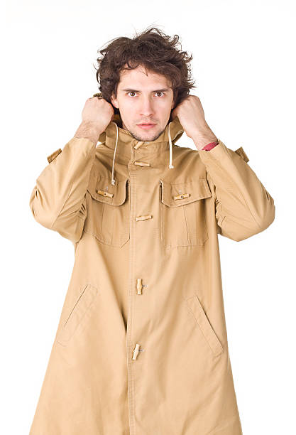 istock Handsome man in light brown vintage raincoat. 471318768