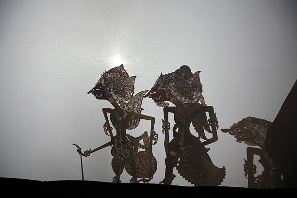 Traditional Indonesian shadow puppet theatre wayang kulit Yogyakarta, Indonesia - August 13, 2011: Traditional Indonesian shadow puppet theatre wayang kulit performs in street in Yogyakarta, Central Java, Indonesia. wayang kulit photos stock pictures, royalty-free photos & images