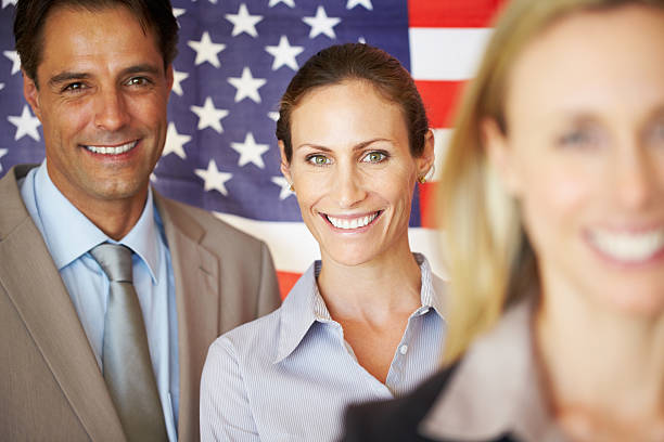 istock Smiling associates with flag 471319443
