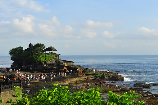 Tanah Lot is a rock formation off the Indonesian island of Bali. It is home of a pilgrimage temple, the Pura Tanah Lot (literally \