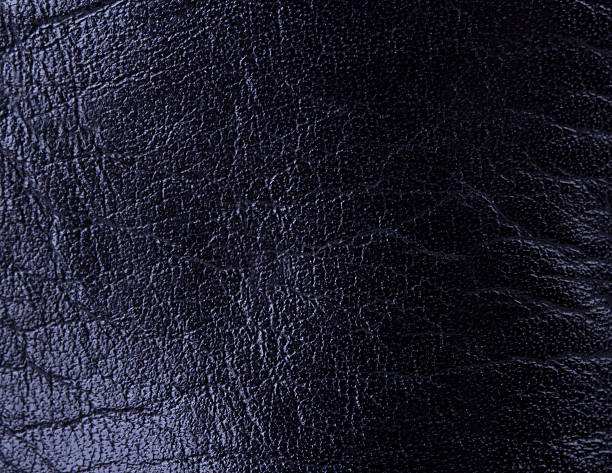 istock Closeup of seamless black leather texture 471325384