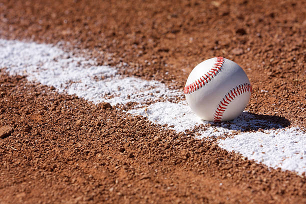 istock Baseball on the Chalk Line 471328399