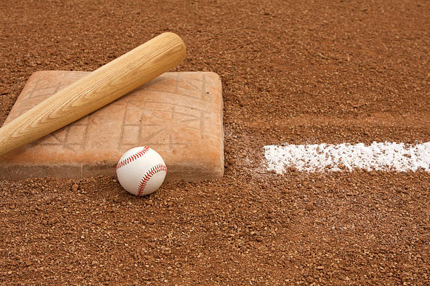 istock Baseball and Bat near the Base 471328411