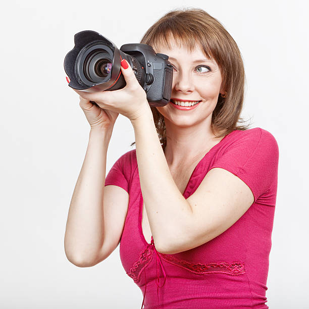 istock Young woman photographing 471329845