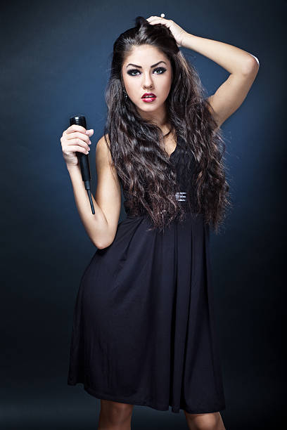 istock beautiful young woman singer 471329953