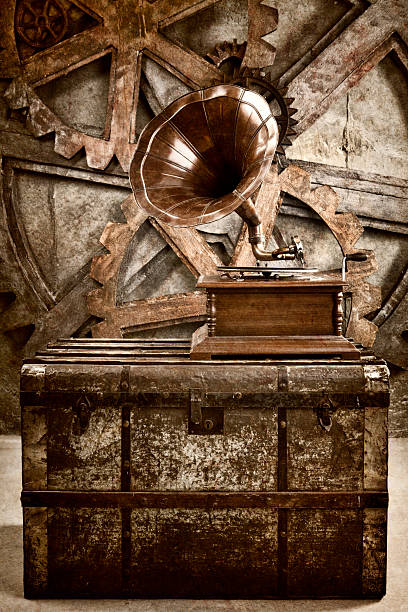 Steampunk Still Life Steampunk Gramophone on trunk with gears. steampunk fashion stock pictures, royalty-free photos & images