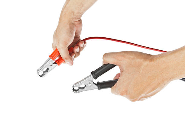 istock Human hand giving to charge battery 471331841