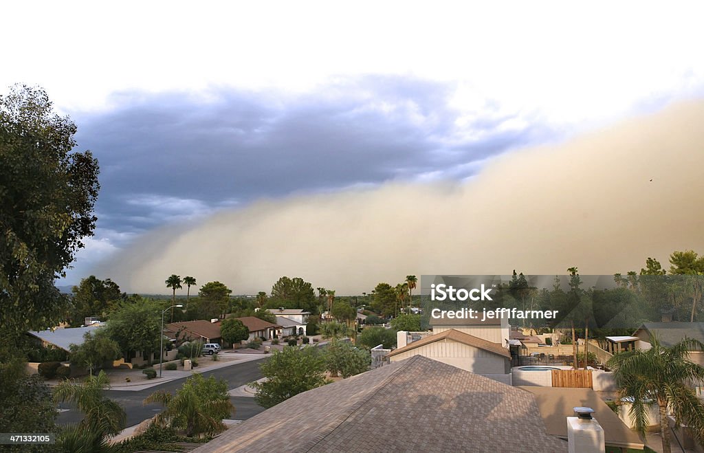 Dust storm rolling over residential area  Desert dust storm ("Haboob") rolling in across the city. Arizona Stock Photo