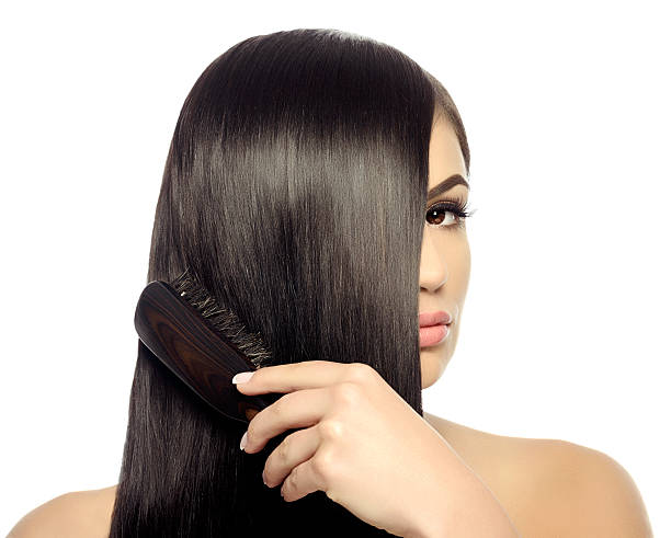 istock brushing long black hair 471332284