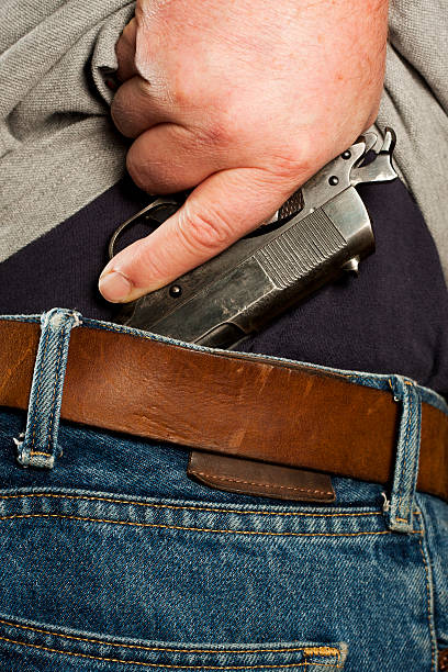 istock Mexican Carry - Concealed Firearm Drawn From Waistband 471332403
