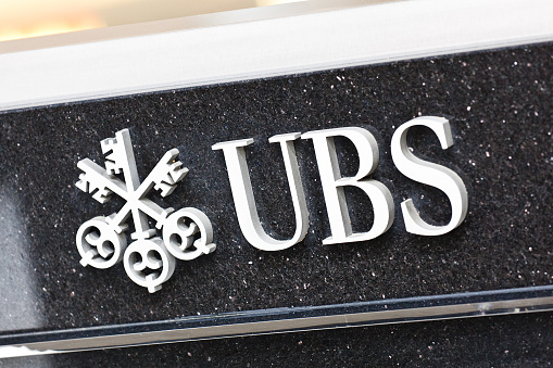 Houston, USA - April 4, 2011: view of and UBS sign located in downtown Houston. UBS is a Swiss global financial services company headquartered in Basel and Zürich, Switzerland, which provides investment banking, asset management, and wealth management services for private, corporate, and institutional clients worldwide.