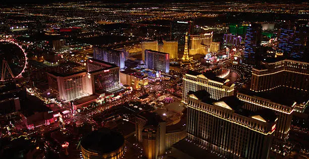 Las Vegas at night - an aerial shot of the buildings, lights, fountain, and general city nightlife.