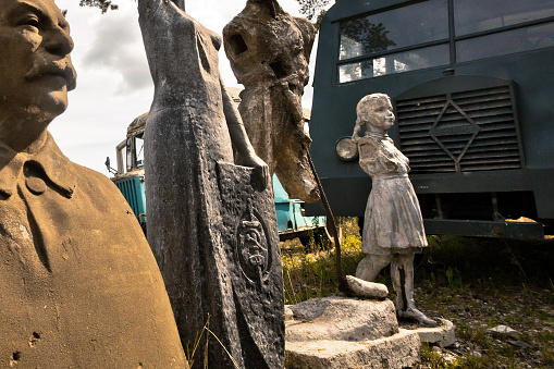 Talicy, Russia - August 27, 2011: Symbols of Stalin Epoch in the Historic Museum. Broken sculptures in park