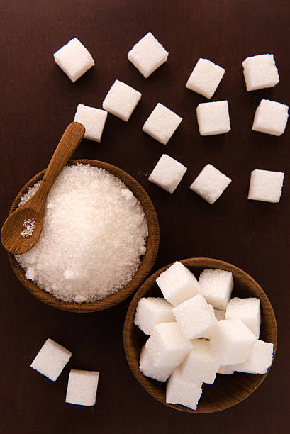 istock Sugar and Sugar Cube on Wood Background 471332736