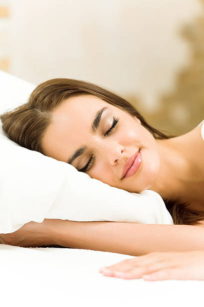 istock Young woman sleeping at home 471333151