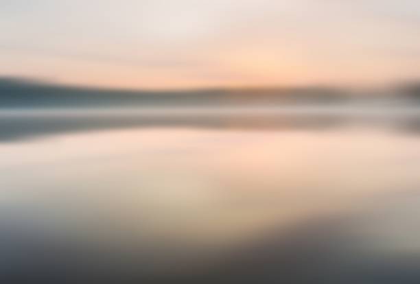 istock Blurry lake landscape useful as background 471333210