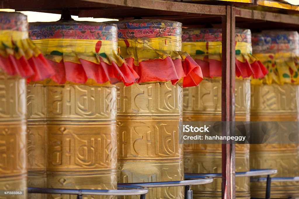 tibetan prayer wheels tibetan prayer wheels in gompa, Tibet. Ancient Stock Photo