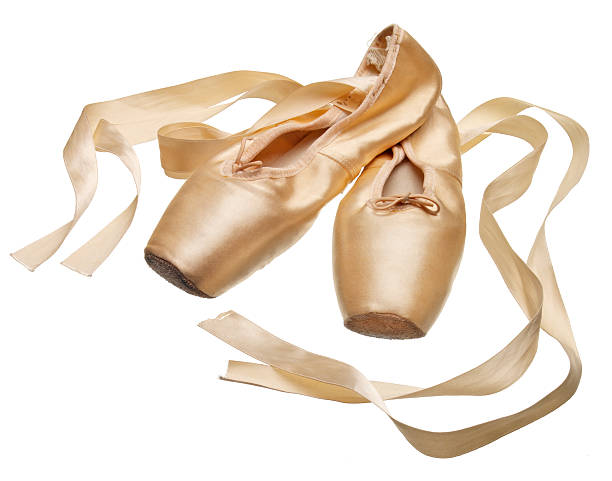 Pointe ballet slippers on white background Ballet slippers, toe shoes on white background.  Photographed on light table. See other shoes in my "On White" Lightbox. ballerina shoes stock pictures, royalty-free photos & images