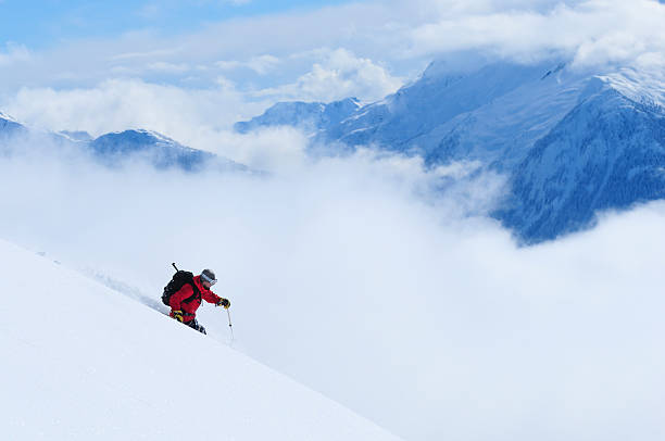 istock Skier going down a hill with arms out and crouched low 471335335