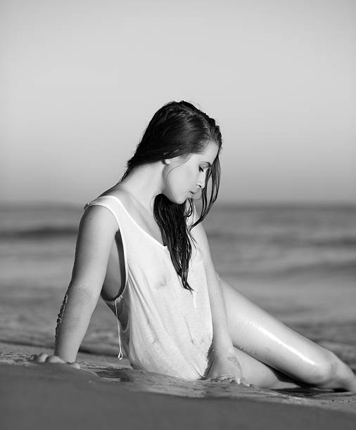 istock sexy woman lying on beach 471336104