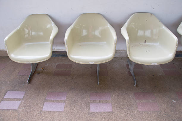 istock Empty airport terminal waiting area with chairs 471336422