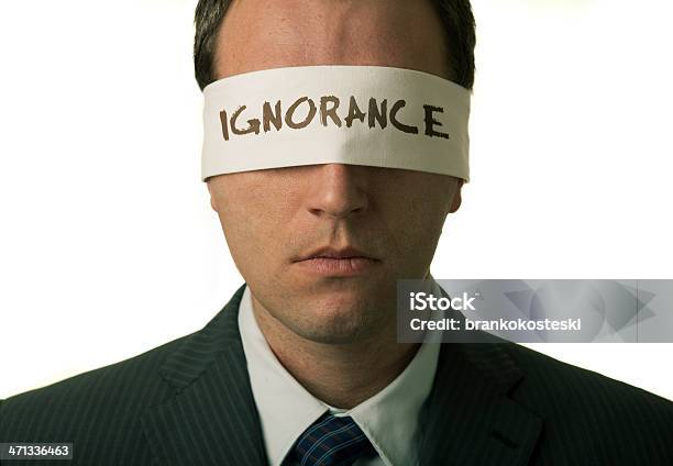 Man Wearing Suit And Tie And Blindfold With Ignorance On It Stock Photo - Download Image Now