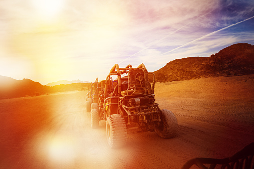 rear view of atv in desert at sunset.travel concept.