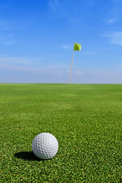 istock golf ball and green field 471336534