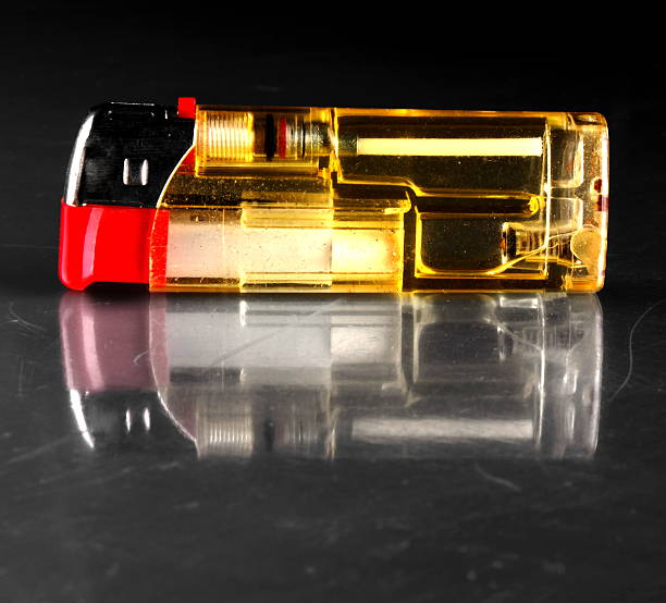istock Studio shot of a yellow and red lighter 471336722