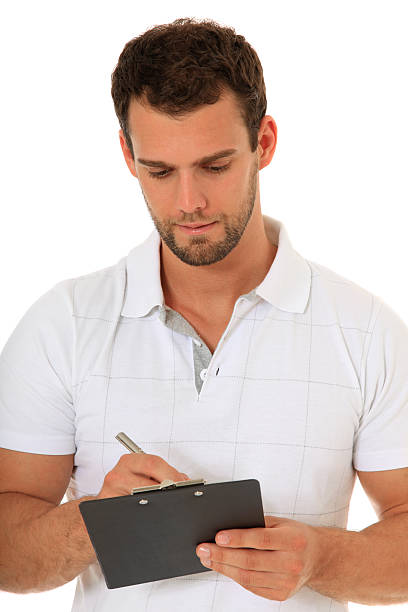 istock Fitness coach writing on clipboard 471336779