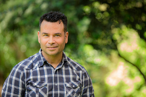 istock Handsome man outdoors in spring or summer. Nature background. 471337630